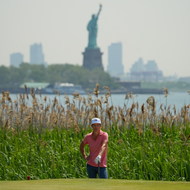 Golfer in Liberty State Park with the Statue of Liberty in the background