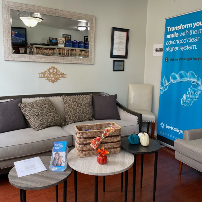 Waiting room at Lucas Dental with couch and coffee tables