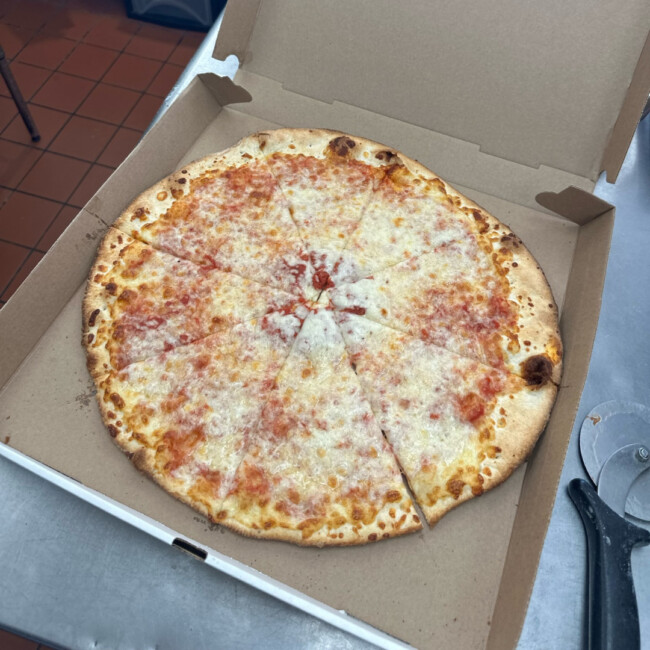 Cheese pizza in pizza box